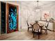 Dining area with decorative front door, charming round table, and decorative accents at 11250 Rivers Bluff Cir, Lakewood Ranch, FL 34202
