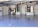 Neat garage with epoxy flooring, built-in cabinets, storage racks, and ample space at 11250 Rivers Bluff Cir, Lakewood Ranch, FL 34202
