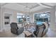 Bright living room with high ceilings, modern decor, and sliding glass doors to the pool area at 11250 Rivers Bluff Cir, Lakewood Ranch, FL 34202
