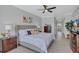 Elegant main bedroom featuring a tray ceiling, stylish decor, and ample natural light at 11250 Rivers Bluff Cir, Lakewood Ranch, FL 34202