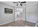 Office space with neutral walls, golf art, and double doors at 11250 Rivers Bluff Cir, Lakewood Ranch, FL 34202
