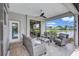 Relaxing outdoor seating area with comfortable seating and a peaceful lake view at 11250 Rivers Bluff Cir, Lakewood Ranch, FL 34202