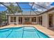 Sparkling pool with a screened enclosure, brick pavers, and landscaped surroundings at 11250 Rivers Bluff Cir, Lakewood Ranch, FL 34202