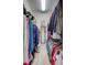 Spacious walk-in closet with ample storage, rods, and shelving for clothes, shoes, and accessories at 11250 Rivers Bluff Cir, Lakewood Ranch, FL 34202