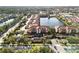 Attractive aerial view of condos by a lake, with dedicated parking and easy road access at 150 L Pavia Blvd # 13, Venice, FL 34292