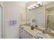 Dual vanity bathroom with large mirror and shower at 150 L Pavia Blvd # 13, Venice, FL 34292