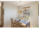 Dining room with bright window and decorative hanging lamp at 150 L Pavia Blvd # 13, Venice, FL 34292
