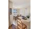 Sun-filled dining room with seating for six and breakfast bar at 150 L Pavia Blvd # 13, Venice, FL 34292
