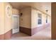 View of the entryway of a building with exterior lighting and unit number 13 at 150 L Pavia Blvd # 13, Venice, FL 34292