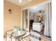 Outdoor patio with seating space and sliding glass doors leading to the living room at 150 L Pavia Blvd # 13, Venice, FL 34292
