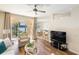 Bright, open-concept living area with seamless access to the screened patio and water views at 150 L Pavia Blvd # 13, Venice, FL 34292