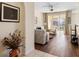 Open concept living room with patio access, ceiling fan, and contemporary furnishings at 150 L Pavia Blvd # 13, Venice, FL 34292