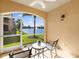 Relaxing screened patio featuring outdoor seating and scenic water views at 150 L Pavia Blvd # 13, Venice, FL 34292