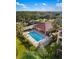 Inviting community pool with lounge chairs and covered pavilion for relaxing by the water at 150 L Pavia Blvd # 13, Venice, FL 34292