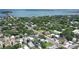 Expansive aerial view of the neighborhood and coastal surroundings, highlighting a property's location at 1738 Siesta Dr, Sarasota, FL 34239