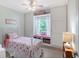 Bedroom with a built-in seat, shelves, and a storage cabinet at 1738 Siesta Dr, Sarasota, FL 34239