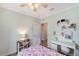 Bedroom with decor on shelves and desk, with an open doorway at 1738 Siesta Dr, Sarasota, FL 34239