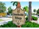 Charming Southside Village shops sign with lush landscaping and clear blue skies overhead at 1738 Siesta Dr, Sarasota, FL 34239