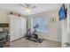 Exercise room with a stationary bike and storage cabinet at 1738 Siesta Dr, Sarasota, FL 34239
