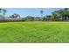 Expansive green field, perfect for recreational activities at 1738 Siesta Dr, Sarasota, FL 34239