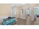 Hallway with fish tank and a glimpse of the bedroom through the doorway at 1738 Siesta Dr, Sarasota, FL 34239