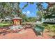 Neighborhood feature showcasing a decorative water fountain with a nearby bench at 1738 Siesta Dr, Sarasota, FL 34239