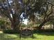Decorative 'Granada Neighborhood' sign with lush landscaping at 1738 Siesta Dr, Sarasota, FL 34239