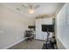 Office featuring a stationary bike, wall-mounted TV, and built-in storage at 1738 Siesta Dr, Sarasota, FL 34239