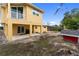 A spacious backyard with an outdoor kitchen, porch and fire pit, great for entertaining at 204 21St Ne St, Bradenton, FL 34208