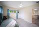 Bright bedroom featuring a single bed, tile floors, and large window with pleasant views at 204 21St Ne St, Bradenton, FL 34208