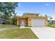 Inviting single Gathering home with a two car garage, manicured lawn, and yellow exterior paint at 204 21St Ne St, Bradenton, FL 34208