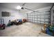 Spacious garage with ample storage space, featuring an automatic garage door opener at 204 21St Ne St, Bradenton, FL 34208