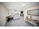 A stylish living room seamlessly connects to a modern kitchen with an open floor plan at 204 21St Ne St, Bradenton, FL 34208