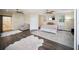 Spacious main bedroom boasts hardwood floors, neutral walls, and a barn door leading to the ensuite bathroom at 204 21St Ne St, Bradenton, FL 34208