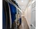 Organized walk-in closet with ample shelving and a view towards another section of the closet at 204 21St Ne St, Bradenton, FL 34208