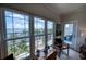 Bright room featuring large windows showcasing amazing waterfront views and access to the lanai at 210 3Rd W St # 8308, Bradenton, FL 34205