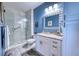 Bathroom with frameless shower, a granite countertop vanity with storage, and modern fixtures for a spa-like experience at 210 3Rd W St # 8308, Bradenton, FL 34205