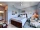 Cozy bedroom features a comfortable queen bed, stylish accent chair, and a charming ensuite bathroom for added convenience at 210 3Rd W St # 8308, Bradenton, FL 34205