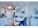 Charming dining area featuring a stylish light fixture and a view of the kitchen at 210 3Rd W St # 8308, Bradenton, FL 34205