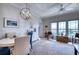 Elegant dining room featuring stylish furnishings, natural light, and serene water view at 210 3Rd W St # 8308, Bradenton, FL 34205