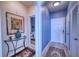 Inviting hallway featuring elegant decor, neutral color palette, and access to a well-appointed bathroom for added convenience at 210 3Rd W St # 8308, Bradenton, FL 34205