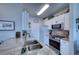 Well-equipped kitchen with granite countertops, modern appliances, and ample cabinet space at 210 3Rd W St # 8308, Bradenton, FL 34205