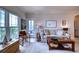 Cozy living room with comfortable seating, natural light, and access to the balcony at 210 3Rd W St # 8308, Bradenton, FL 34205