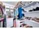 Well-organized walk-in closet with shelving and drawers to maximize storage and keep your wardrobe neatly arranged at 210 3Rd W St # 8308, Bradenton, FL 34205