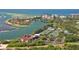 Scenic aerial view overlooking tennis courts, waterfront homes, and beautiful beaches at 225 Sands Point Rd # 6201, Longboat Key, FL 34228