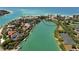 Stunning aerial view of waterfront homes along lush green waterways and Gulf beaches at 225 Sands Point Rd # 6201, Longboat Key, FL 34228