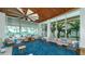 Beautiful seating area with floor to ceiling windows that offer a tranquil outdoor view at 225 Sands Point Rd # 6201, Longboat Key, FL 34228