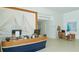 Bright reception area with nautical decor, front desk, and comfortable seating at 225 Sands Point Rd # 6201, Longboat Key, FL 34228