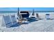 Upscale beach rentals include luxurious lounge seating and striped umbrellas available for a relaxing seaside experience at 225 Sands Point Rd # 7205, Longboat Key, FL 34228