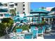 Outdoor patio featuring ample seating with tables and chairs and lots of shade provided by stylish umbrellas at 225 Sands Point Rd # 7205, Longboat Key, FL 34228
